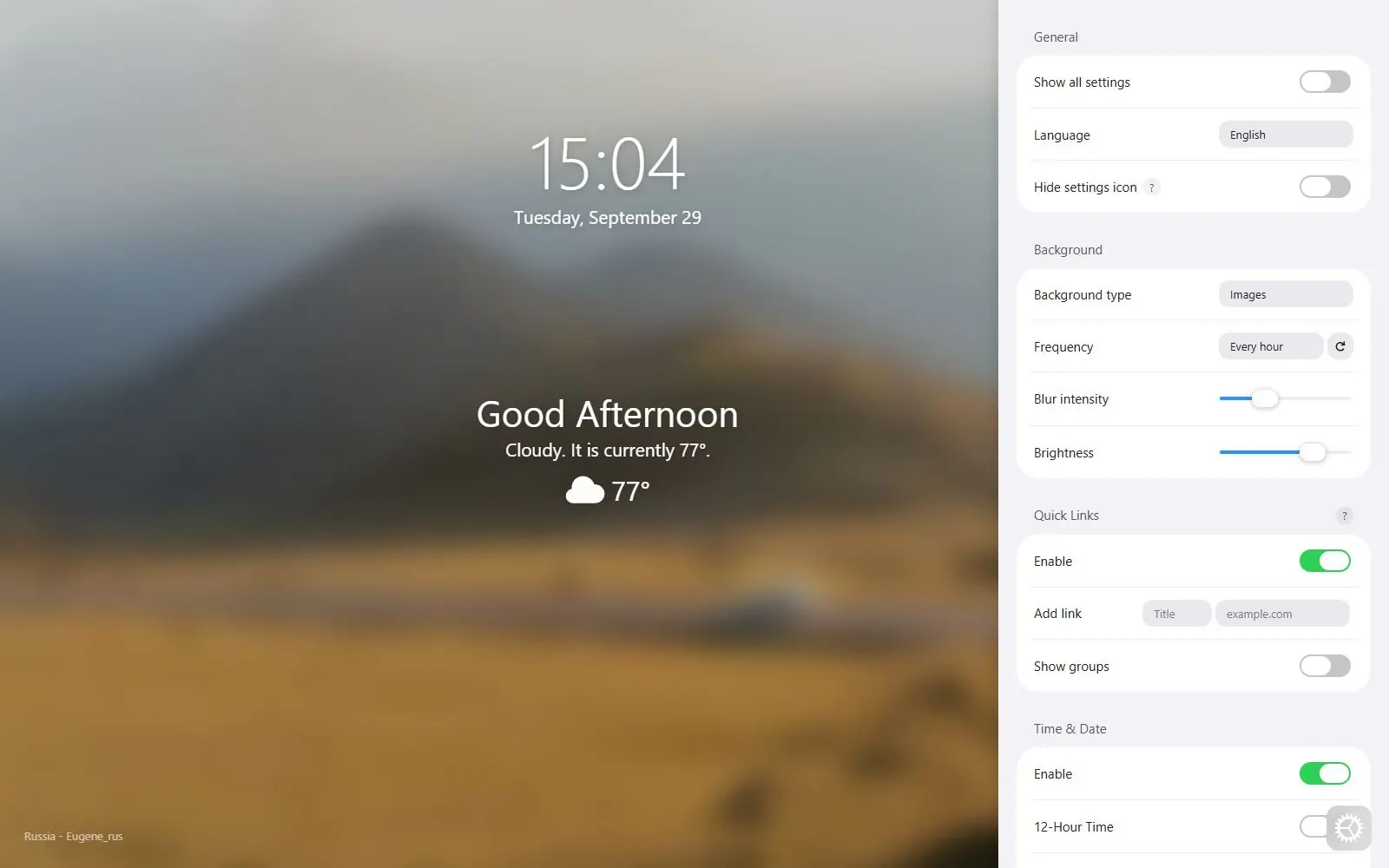 Bonjourr's new tab with a large 24-hour clock, the date, a Good Afternoon greeting and a cloudy weather line over a blurred mountain photo, beside an open settings panel with background, quick link and time and date options